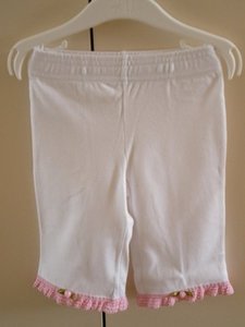 Broekje roze ruche met roosje